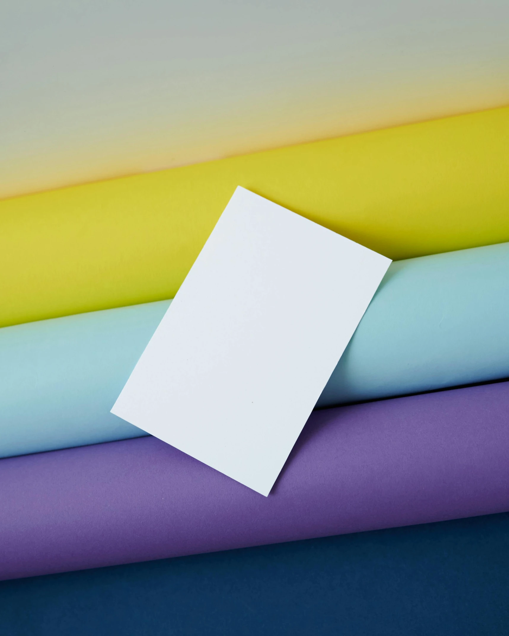 a piece of paper sitting on top of a pile of colored sheets, by Grace Polit, unsplash, color field, rainbow tubing, greeting card, labels, standing still