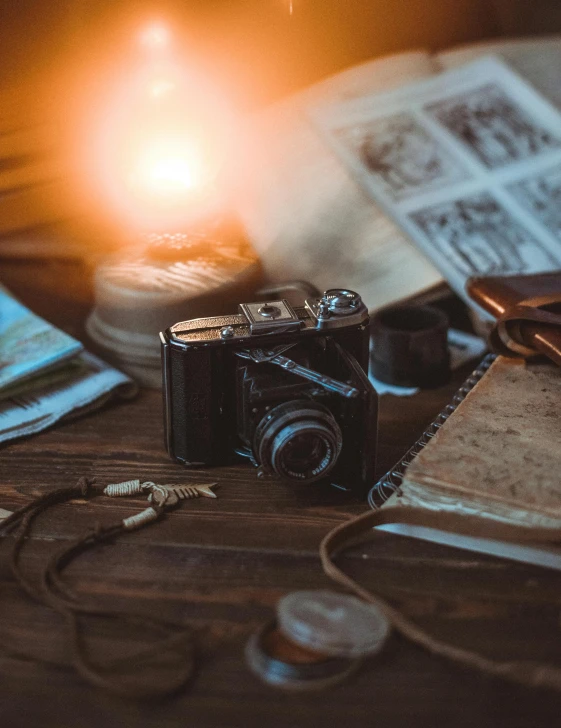 a camera sitting on top of a wooden table, dimly lit, vintage aesthetic, portrait of an adventurer, multiple stories