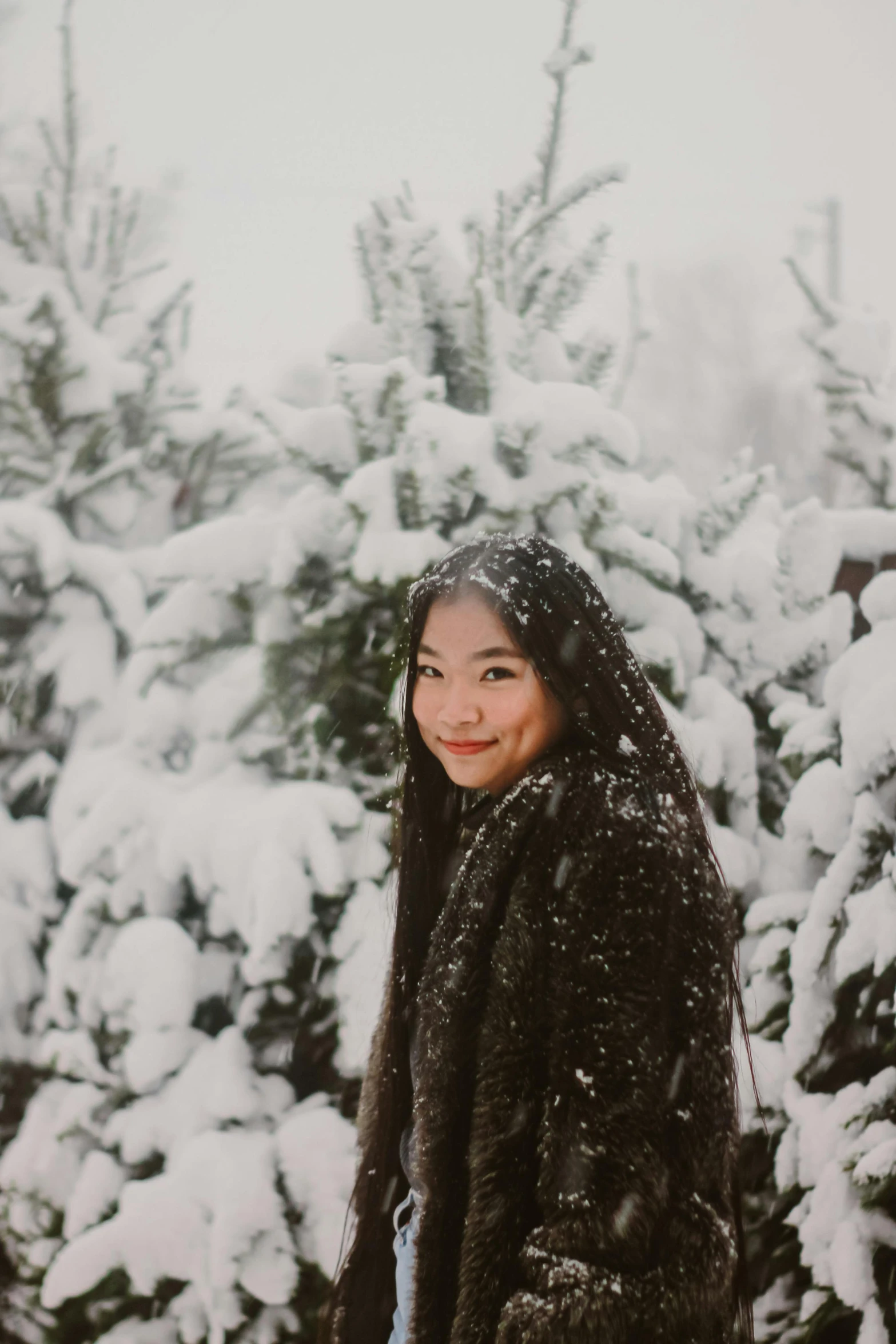 a woman standing in front of snow covered trees, asian descent, covered!, 2019 trending photo, beautiful nordic woman