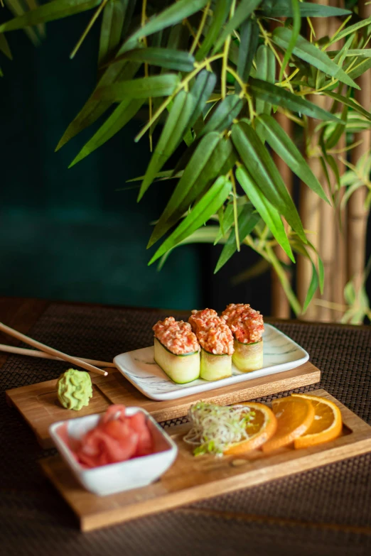 a close up of a plate of food on a table, inspired by Ryōhei Koiso, unsplash, mingei, bonsai trees, cuban setting, bamboo, square