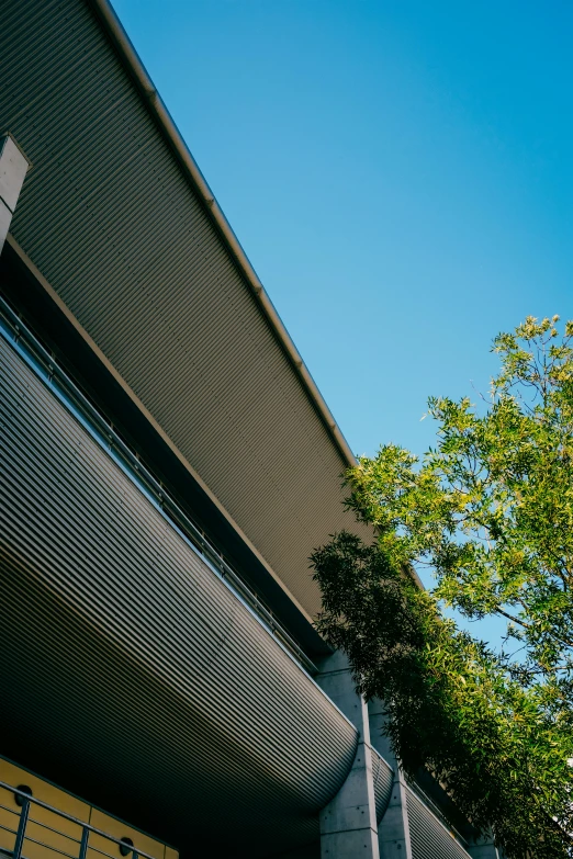 a man flying through the air while riding a skateboard, inspired by Tadao Ando, unsplash, vancouver school, exterior view, roof with vegetation, detail structure, low-angle