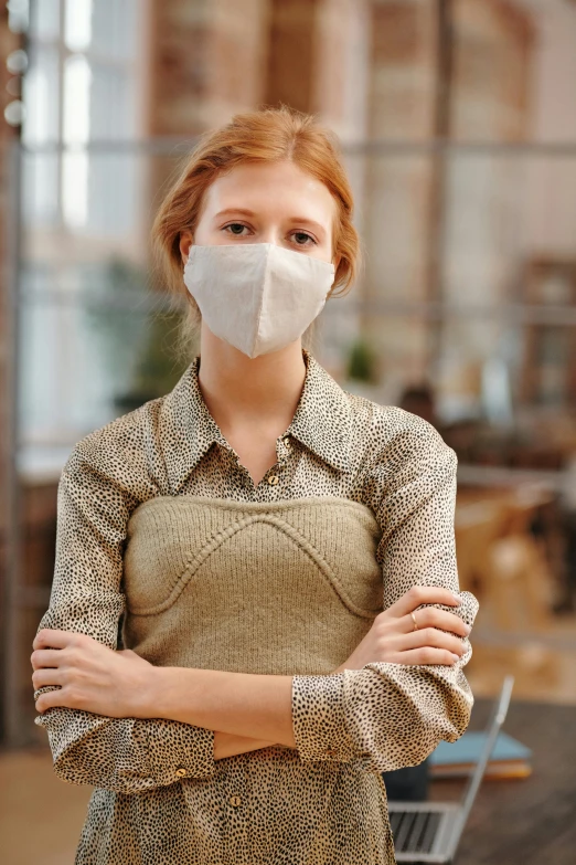 a woman wearing a face mask standing in front of a shopping cart, renaissance, standing in a restaurant, beige, a redheaded young woman, wearing lab coat and a blouse