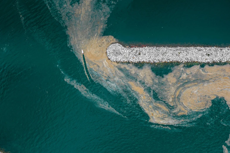 a large body of water next to a pier, an album cover, inspired by Andreas Gursky, unsplash contest winner, hurufiyya, landfill, satellite view, biroremediation, thumbnail