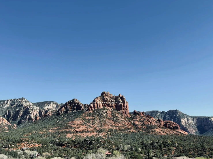 a scenic view of the red rocks of sedona, a photo, pexels contest winner, plein air, clear blue skies, mountainous, jen yoon, slightly pixelated