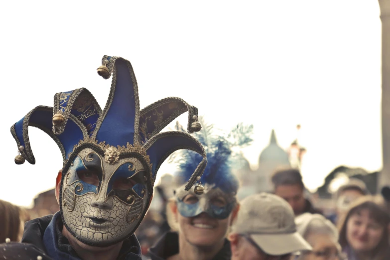 a close up of a person wearing a mask, pexels contest winner, renaissance, parade, blue and silver, thumbnail, album cover