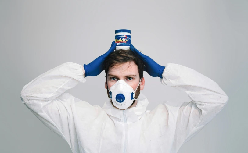 a man wearing a face mask and gloves, a hyperrealistic painting, by Adam Marczyński, pexels contest winner, red bull, white backround, wearing plumber uniform, can of paint