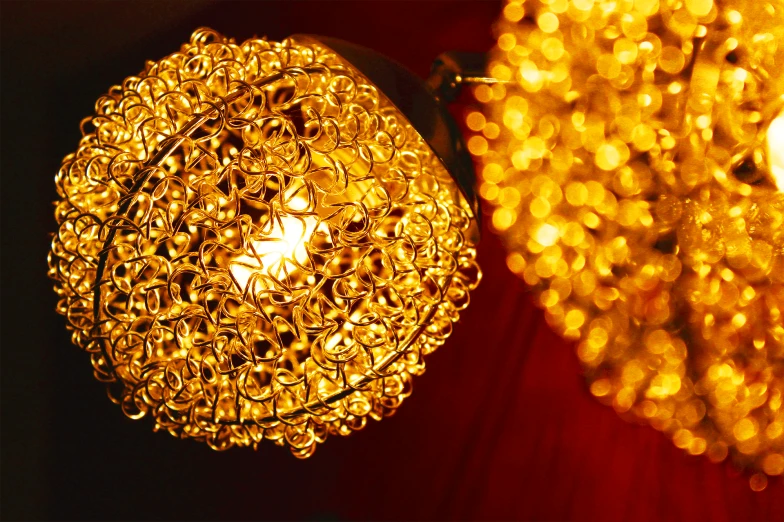 a couple of lights that are next to each other, baroque, golden glistening, some spherical, closeup portrait shot, brightly lit - style atmosphere