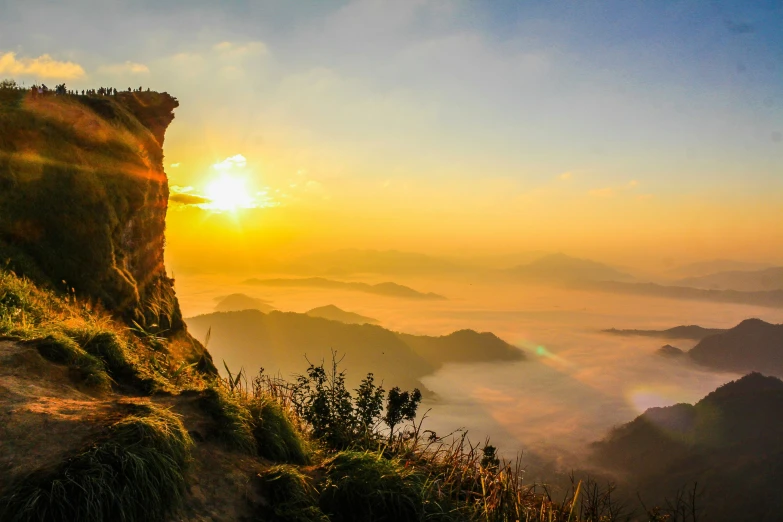 a person standing on top of a mountain at sunset, pexels contest winner, sumatraism, avatar image, taiwan, golden glow, youtube thumbnail