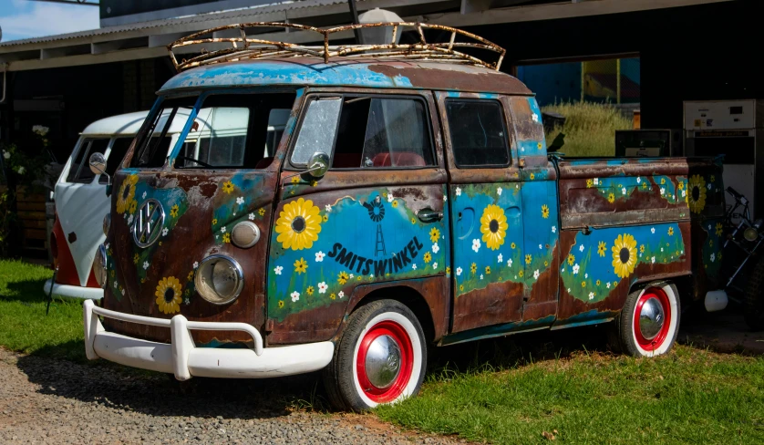 a blue and brown van parked in front of a building, by Tom Bonson, pexels contest winner, graffiti, australian wildflowers, kombi, made of swiss cheese wheels, brown