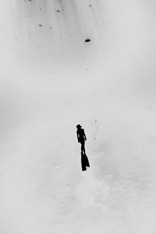 a man riding skis down a snow covered slope, a black and white photo, by Zsolt Bodoni, unsplash contest winner, conceptual art, ffffound, a lonely woman, taking from above, a pilgrim