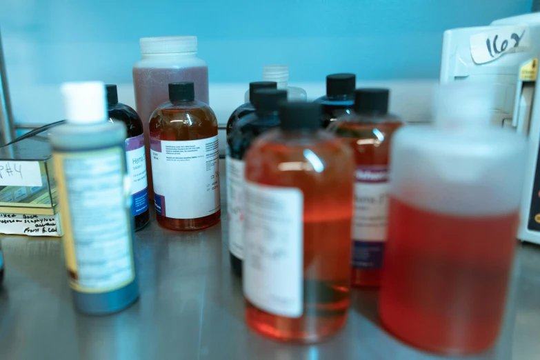 a table topped with lots of bottles of liquid, unsplash, process art, medical research facility, close-up product photo, bath, thumbnail