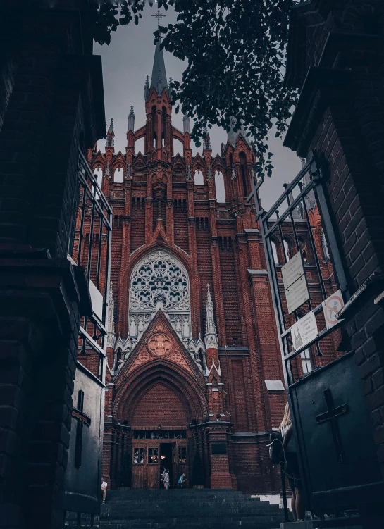 a church with a clock on the front of it, by Adam Marczyński, pexels contest winner, international gothic, gta in moscow, black and terracotta, square, low quality photo