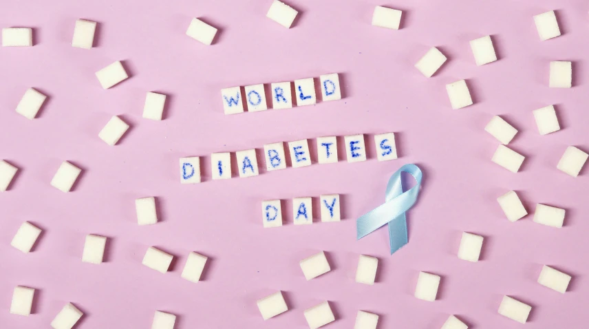 the word world diabetes day surrounded by cubes of sugar and a blue ribbon, an album cover, pastel', photography of kurzgesagt, a delicate, blank