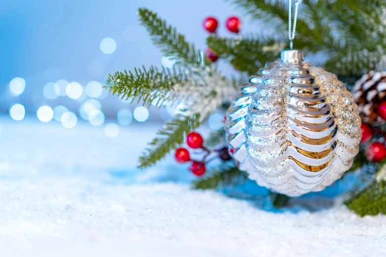 a close up of a christmas ornament in the snow, pexels contest winner, blue and silver, background image, pine, thumbnail