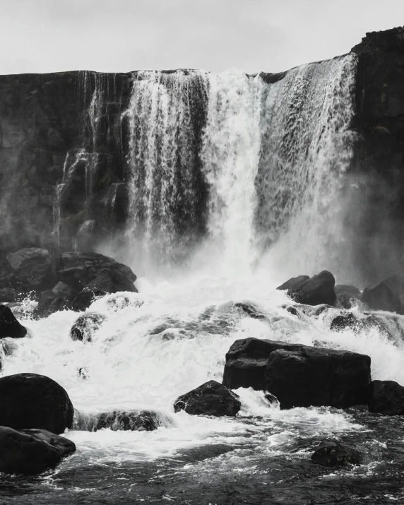 a black and white photo of a waterfall, by Karl Buesgen, pexels contest winner, hamar, album cover, medium format, historical photo
