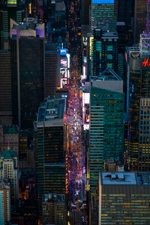 an aerial view of a city at night, happening, in time square, stacked image, square, shot with sony alpha