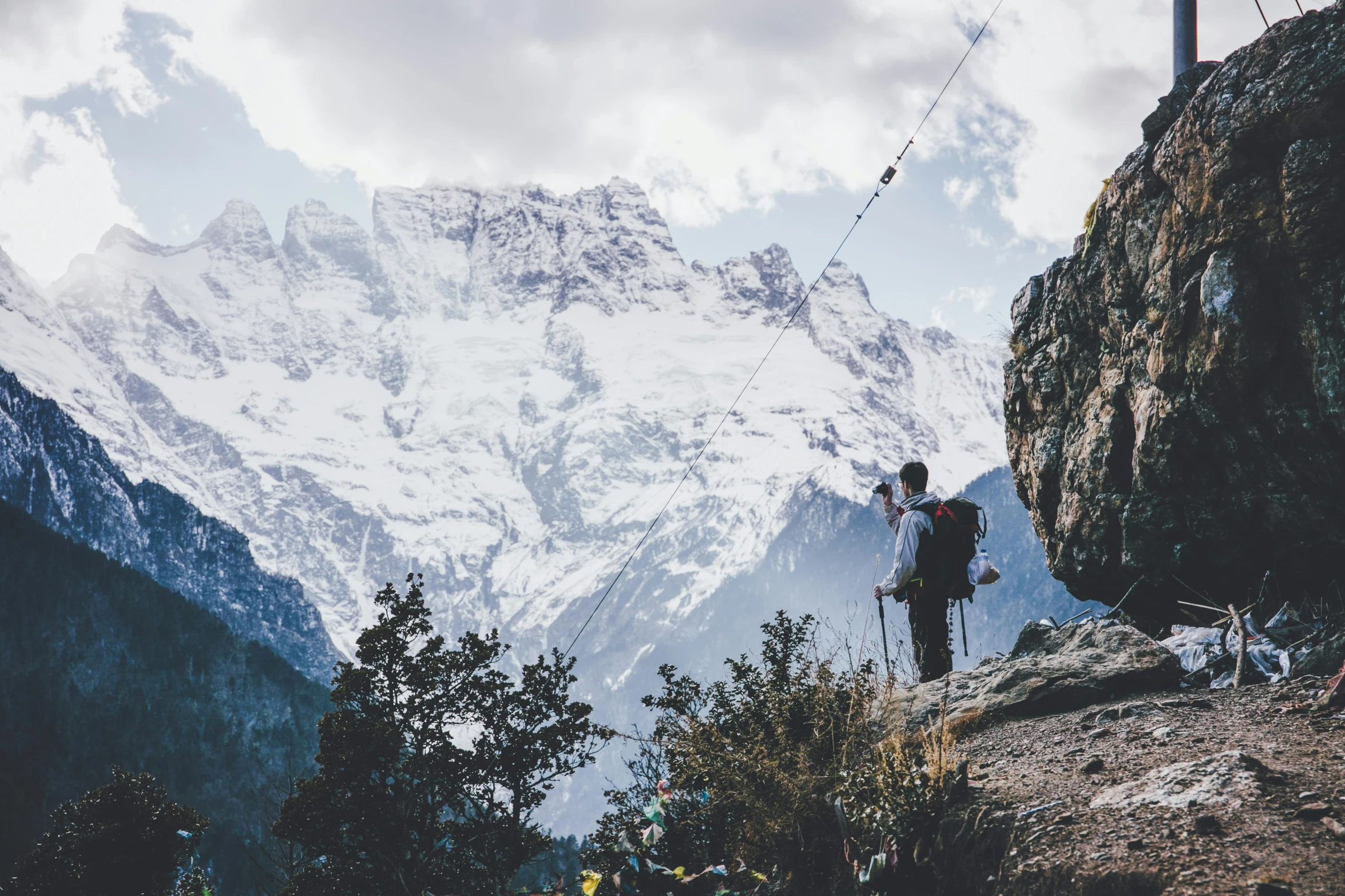 a man with a backpack standing on top of a mountain, pexels contest winner, uttarakhand, profile image, hanging, avatar image