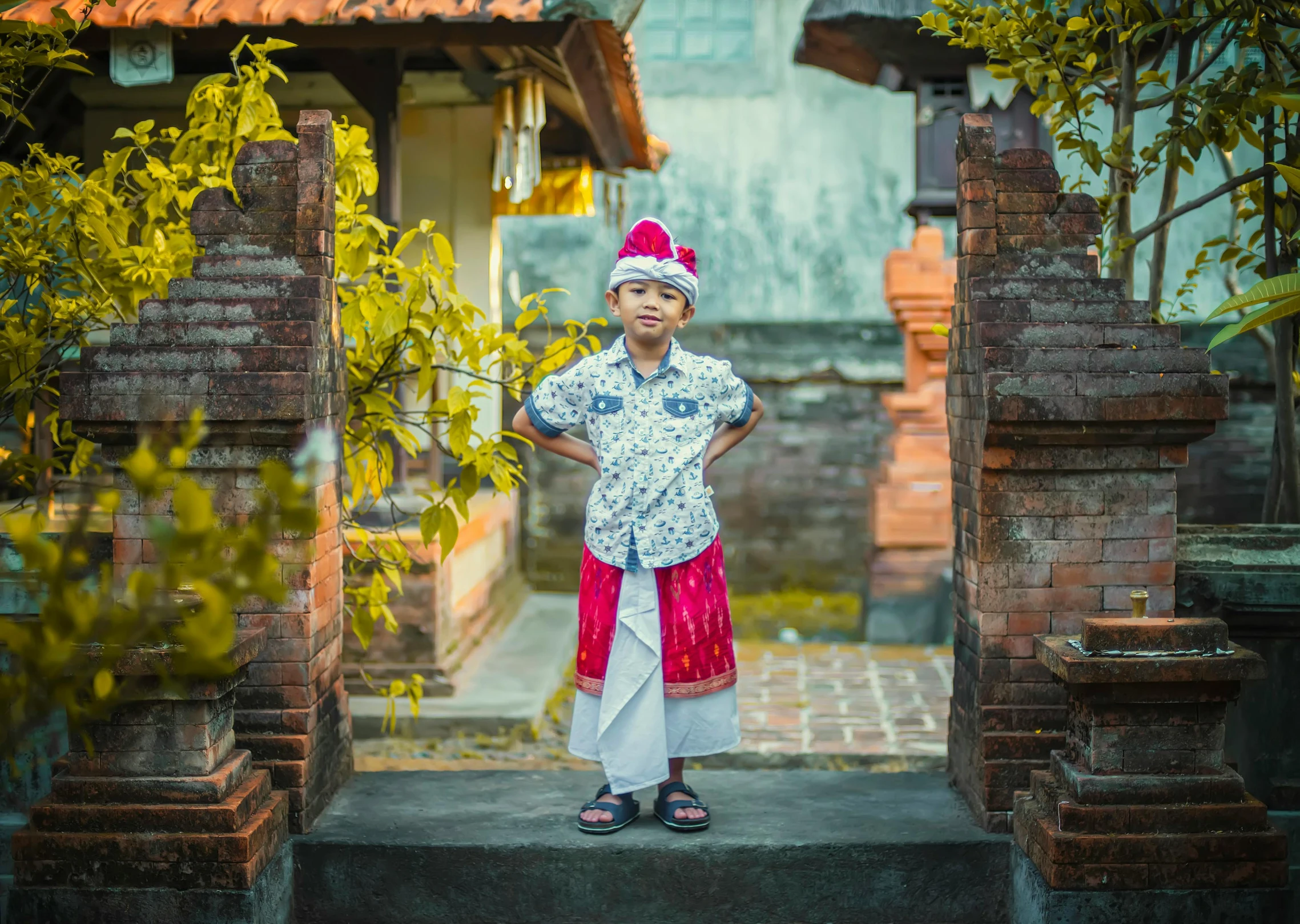 a little girl standing in a doorway with her hands on her hips, inspired by I Ketut Soki, pexels contest winner, wearing festive clothing, teen boy, square, thumbnail