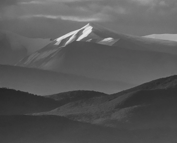 a black and white photo of a mountain range, a black and white photo, by Maurycy Gottlieb, fine art, 1958, contre jour, azamat khairov, photo courtesy museum of art