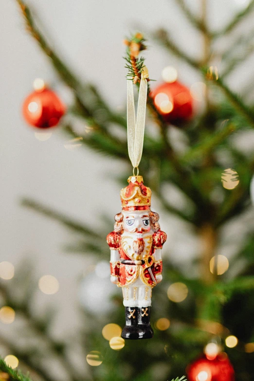 a christmas ornament hanging from a christmas tree, a portrait, by Julia Pishtar, arabesque, carousel, lifestyle, small, view