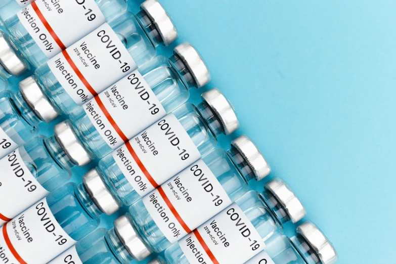 a bunch of vials sitting on top of a blue surface, medical labels, thumbnail, abcdefghijklmnopqrstuvwxyz, thedieline