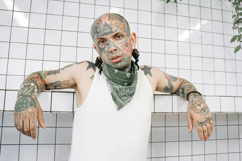 a man with tattoos on his arms and a bandana around his neck, inspired by Brian 'Chippy' Dugan, hypebeast, 2000s photo, mexican, shaved temple