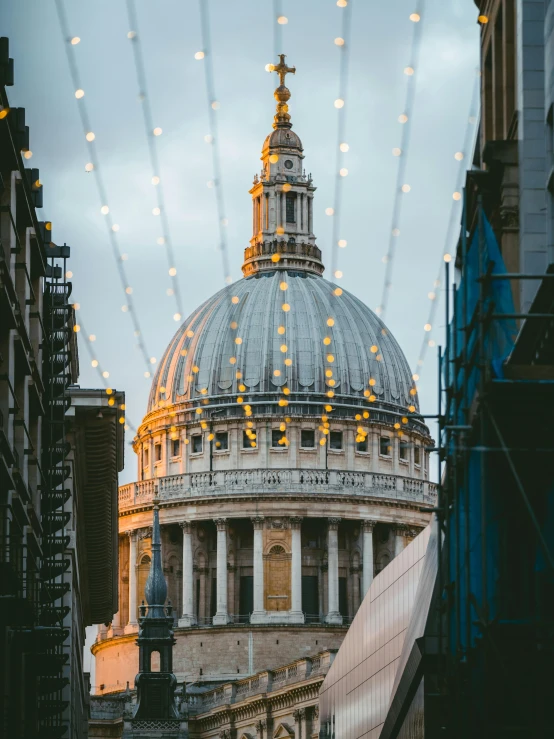 the dome of st paul's cathedral is lit up with christmas lights, pexels contest winner, fine art, profile image, pov photo, city views, golden hour photo