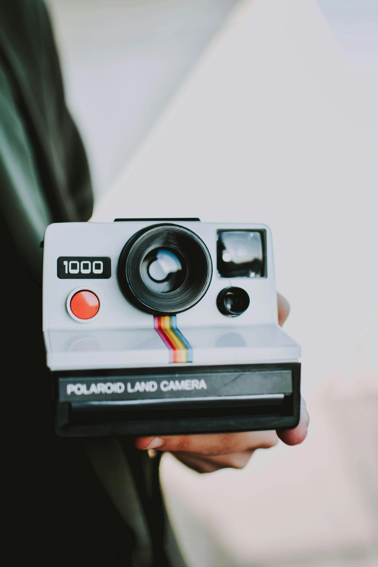 a person holding a polar polar polar polar polar polar polar polar polar polar polar polar polar polar polar polar polar polar polar polar polar polar polar polar, a polaroid photo, unsplash contest winner, hypermodernism, holding a blaster, vintage camera