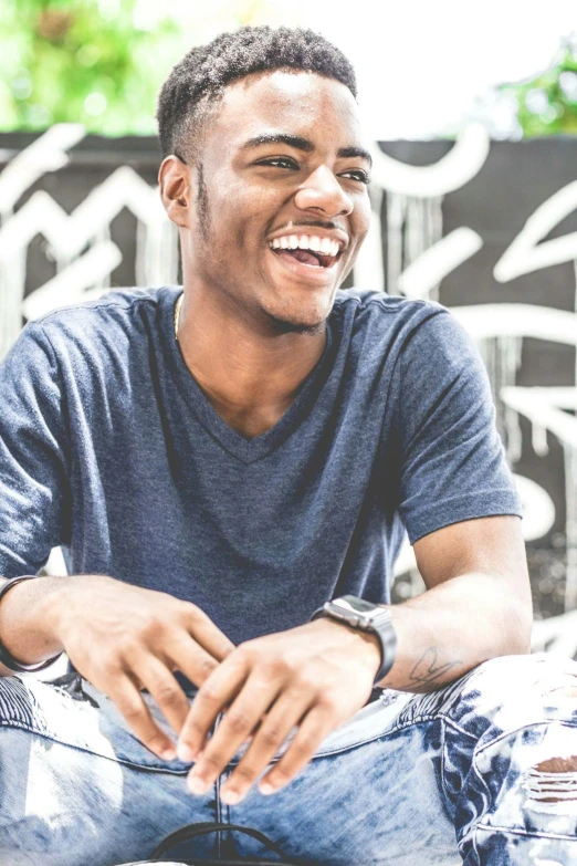 a close up of a person sitting on a skateboard, happening, brown skin man with a giant grin, highly upvoted, smiling :: attractive, wearing a shirt and a jean
