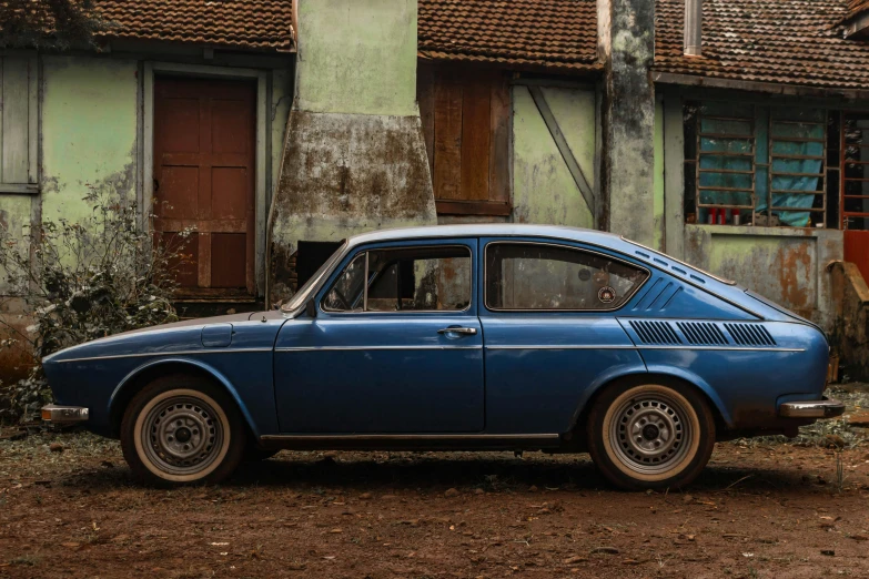 a blue car parked in front of a building, inspired by T. K. Padmini, pexels contest winner, hyperrealism, avatar image, rustic, brown, big arches in the back