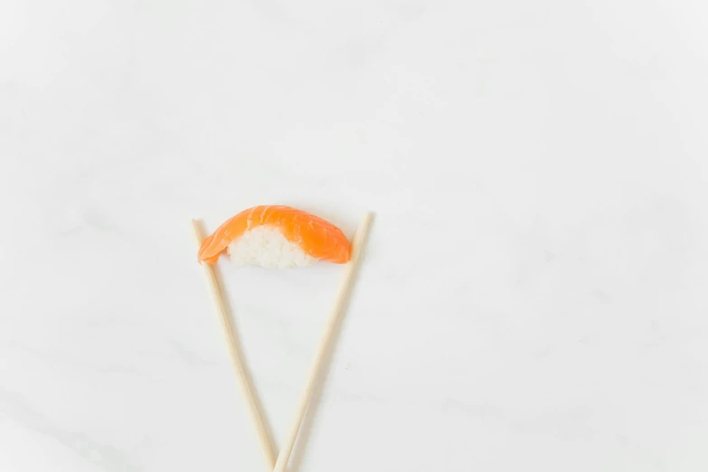 a white plate topped with sushi and chopsticks, trending on unsplash, postminimalism, 🦩🪐🐞👩🏻🦳, white minimalistic background, background image, fish tail