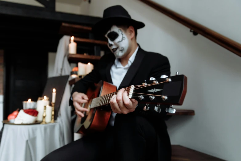 a man in a mask playing a guitar, pexels contest winner, vanitas, dia de los muertos makeup, avatar image, professional image, promotional image