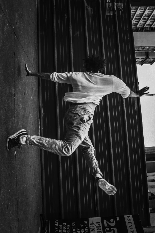 a man flying through the air while riding a skateboard, an album cover, unsplash, playboi carti, bw, behind the wall, walking away