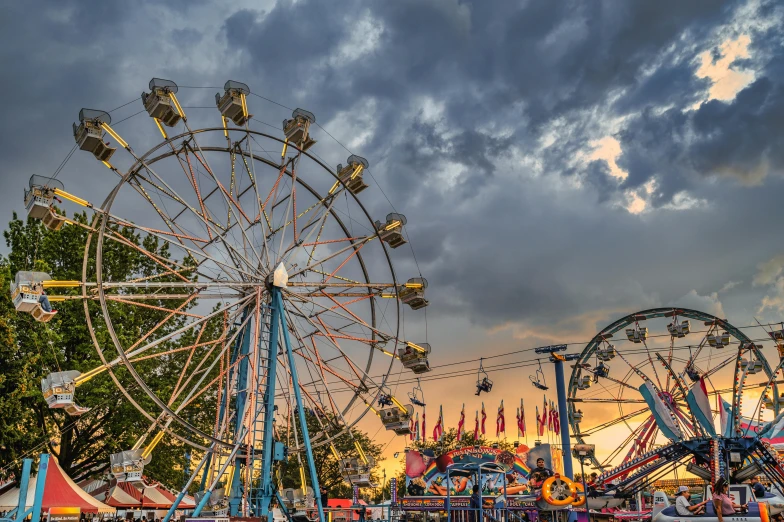 a large ferris wheel sitting in the middle of a park, by Dan Frazier, pexels contest winner, temple fair, avatar image, panoramic photography, summer evening