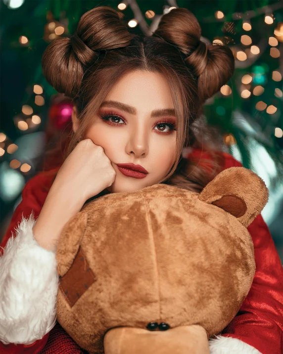 a woman sitting in front of a christmas tree holding a teddy bear, a colorized photo, by Julia Pishtar, trending on instagram, sexy face with full makeup, brown hair in two buns, photo style of shawn paul tan, trending on cgstation