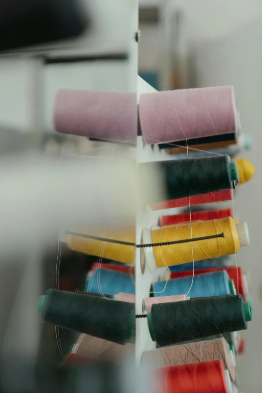 a close up of a bunch of spools of thread, a picture, by Werner Gutzeit, unsplash, made of lab tissue, behind the scenes, photographed for reuters, color footage