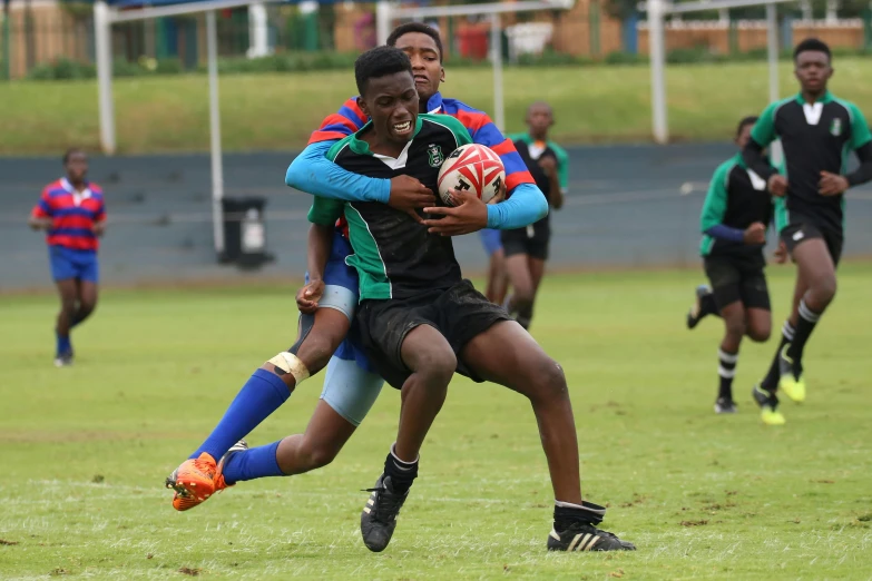 a group of young men playing a game of rugby, photo taken in 2018, ussa, sprinting, david uzochukwu