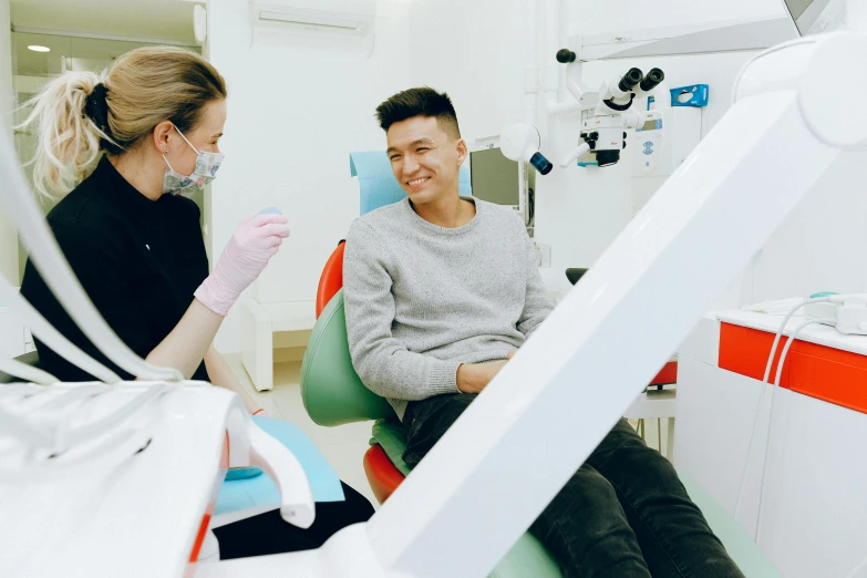 a couple of people that are sitting in a chair, large teeth, darren quach, profile image, clean medical environment