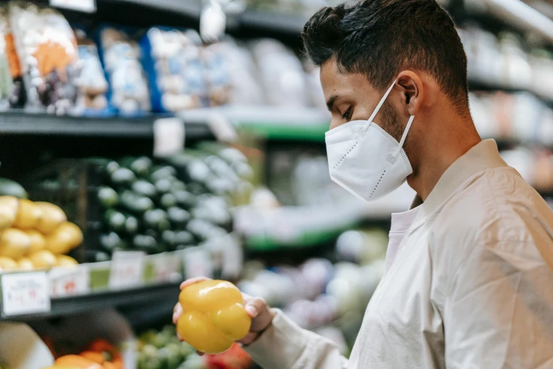 a man wearing a face mask in a grocery store, pexels, avatar image, new zeeland, man holding a balloon, fresh food market people