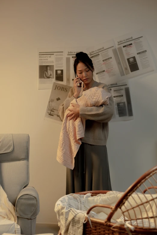 a woman standing in a living room talking on a cell phone, poster art, by Jang Seung-eop, unsplash, happening, maternity feeling, covered with blanket, photorealistic movie still, journalism photo