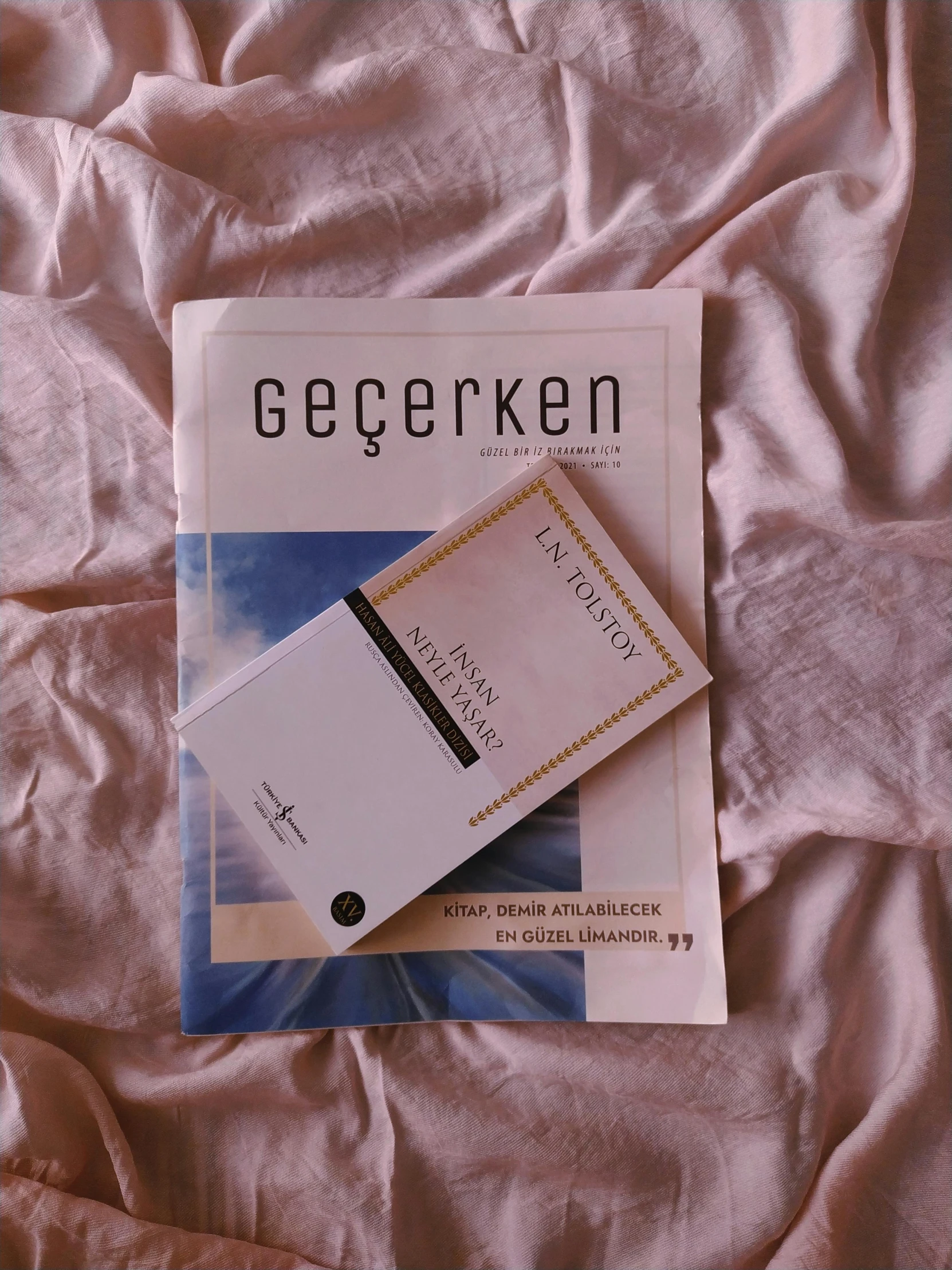a book sitting on top of a bed, an album cover, by Geertgen tot Sint Jans, ticket, けもの, magazine photograph, sofya emelenko