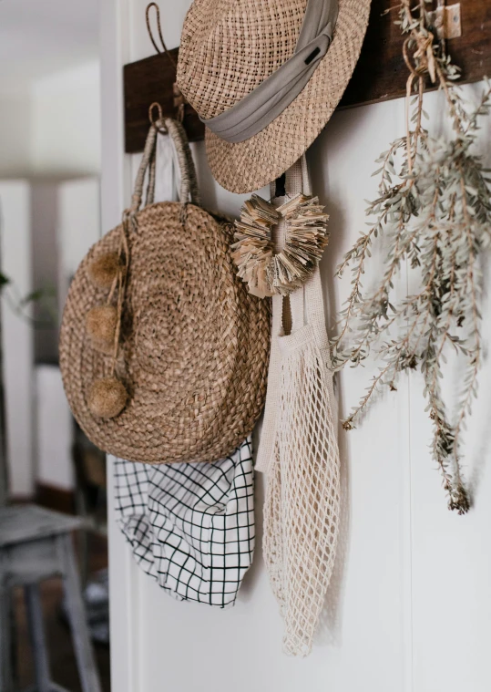 a bunch of hats hanging on a wall, pexels contest winner, bag, in a white boho style studio, natural materials :: high detail, profile image