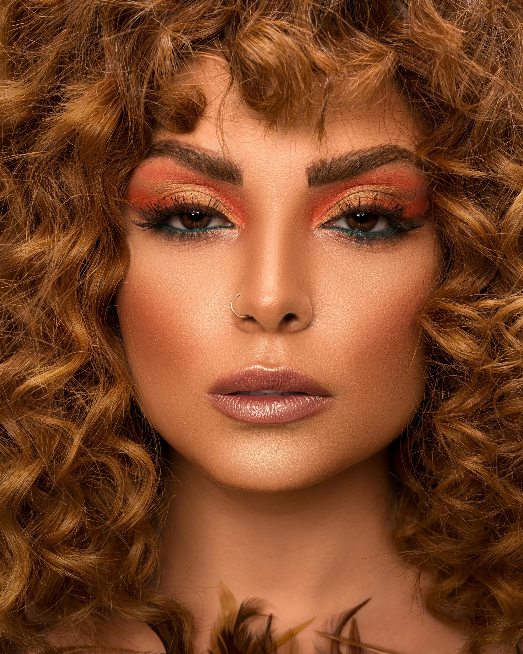 a close up of a woman with curly hair, inspired by Charly Amani, golden fire palette, tanned ameera al taweel, detailed product image, drag