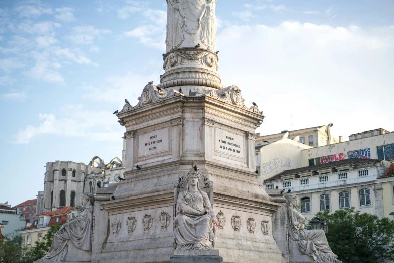 a statue in the middle of a city square, by Luis Molinari, pexels contest winner, neoclassicism, lisbon, calcutta, parce sepulto, saint womans