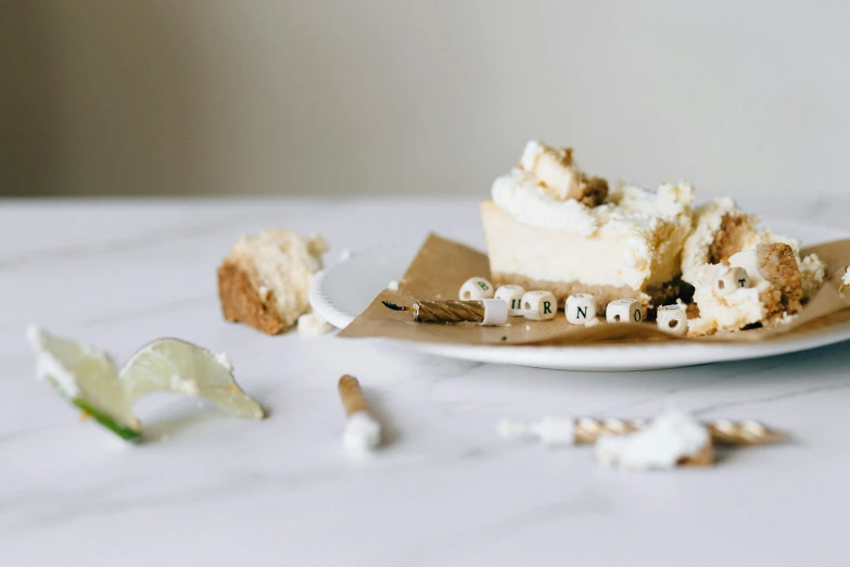 a piece of pie sitting on top of a white plate, a marble sculpture, by Emma Andijewska, trending on unsplash, with names, eating cheese, celebration, marshmallows