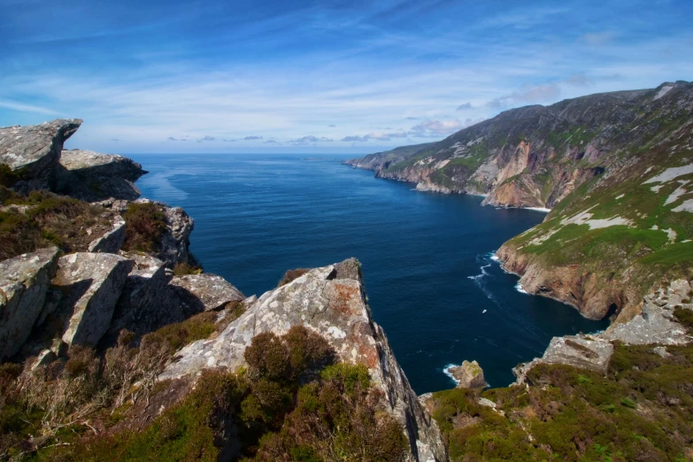 a view of the ocean from the top of a mountain, by Eamon Everall, pexels contest winner, happening, coastal cliffs, irish mountains background, thumbnail, conde nast traveler photo