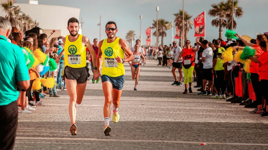 a couple of men that are running in a race, by Giorgio Cavallon, pexels contest winner, costa blanca, avatar image, panels, 15081959 21121991 01012000 4k