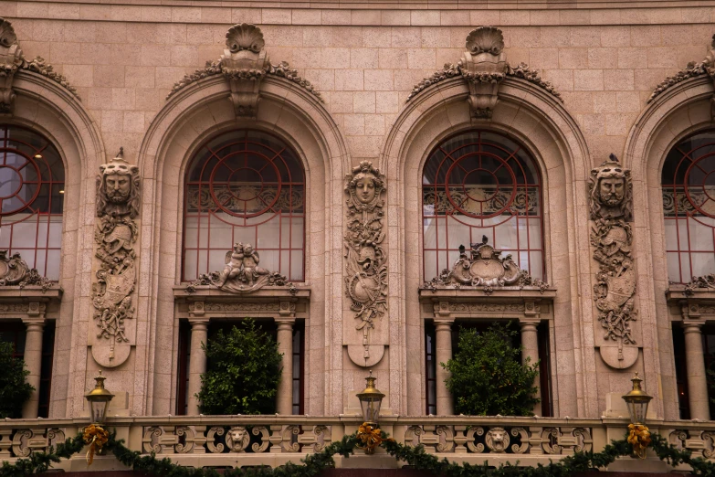 a close up of a building with many windows, a marble sculpture, inspired by Mihály Munkácsy, pexels contest winner, art nouveau, archways made of lush greenery, rococo decorations, san francisco, during autumn