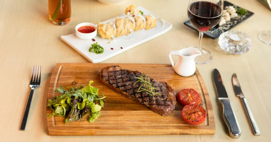 a wooden cutting board topped with meat and vegetables, a picture, offering a plate of food, steak, arrendajo in avila pinewood, angled