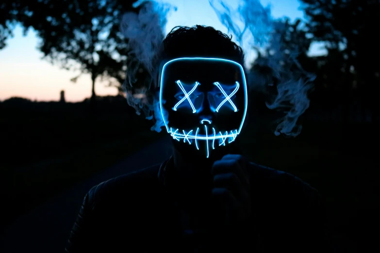 a man wearing a neon mask with smoke coming out of his mouth, an album cover, by Sebastian Vrancx, pexels contest winner, blue leds, halloween, discord profile picture, vandalism